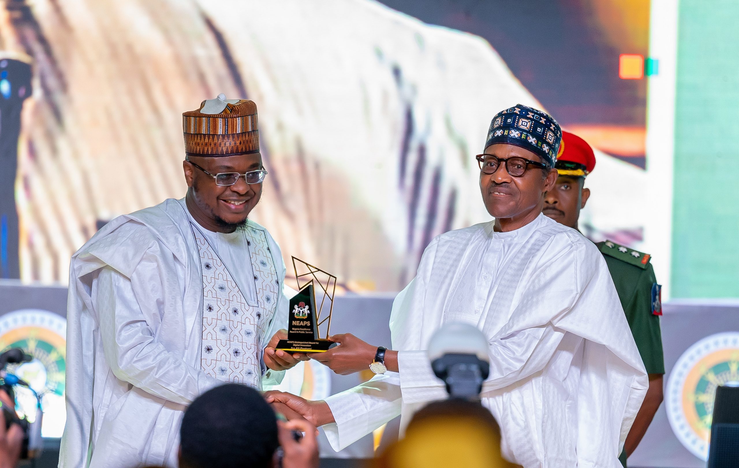 HE Presdient Muhammadu Buhari presenting the award for Digital Innovation to the Immediate Past Hon. Minister of Communication and Digital Economy, Prof. Isa Ali Pantami
