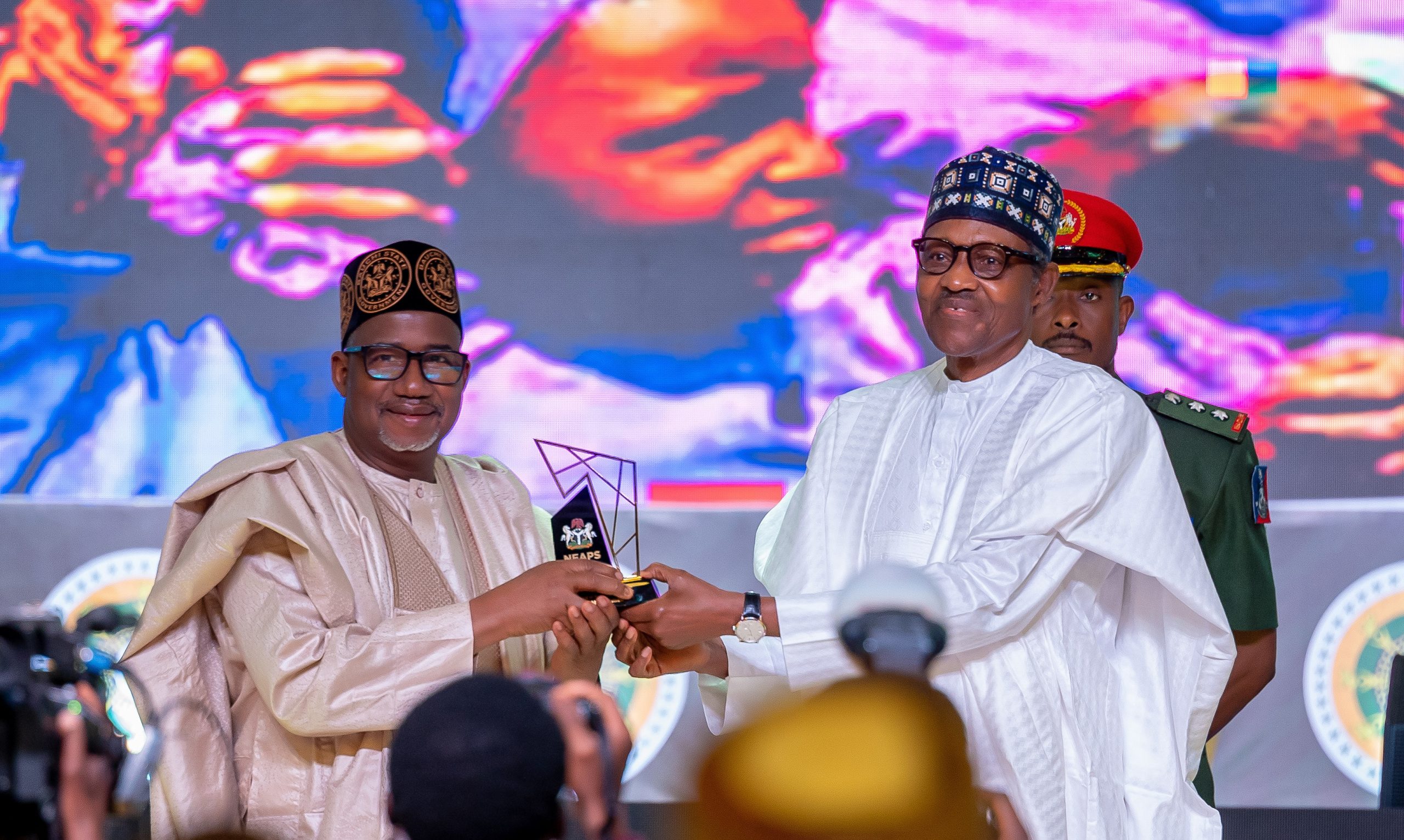 HE Presdient Muhammadu Buhari presenting the award for Excellence in Rural Development to HE Bala Mohammed of Bauchi State