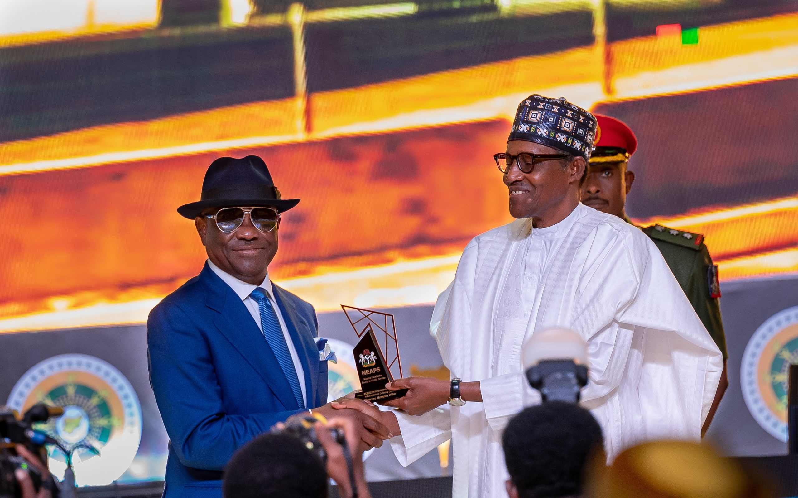 HE Presdient Muhammadu Buhari presenting the award for Infrastructure Delivery (State) to to FCT Minister and the immediate pas Governor of Rivers State,. HE Nyesom Ezenwo Wike