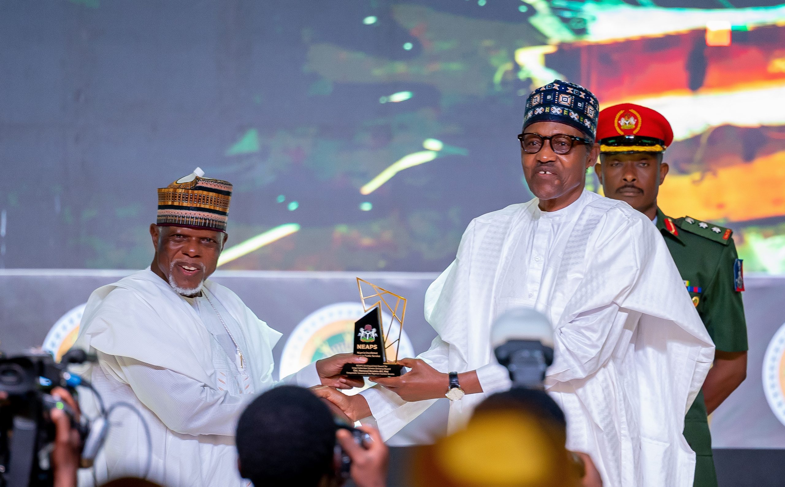 HE Presdient Muhammadu Buhari presenting the award for Levy Collection Service Delivery Award to the Immediate past Comptroller-General, NCS Col. Hameed Ibrahim Ali (Rtd)
