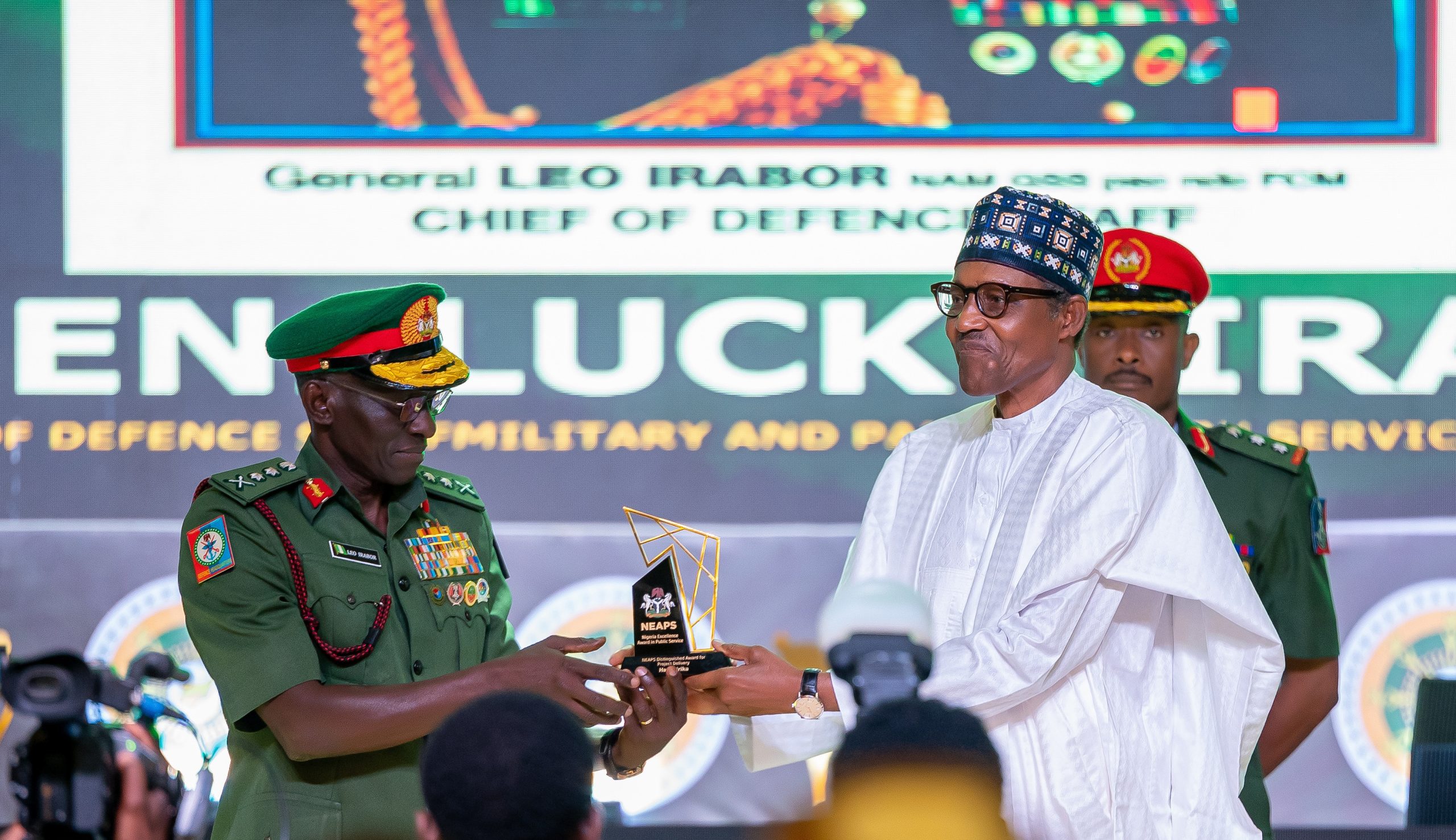 HE Presdient Muhammadu Buhari presenting the award for Military and Paramilitary Service (Special Category) to the Immediate Past Chief of Defence Staff, Gen. Lucky Irabor