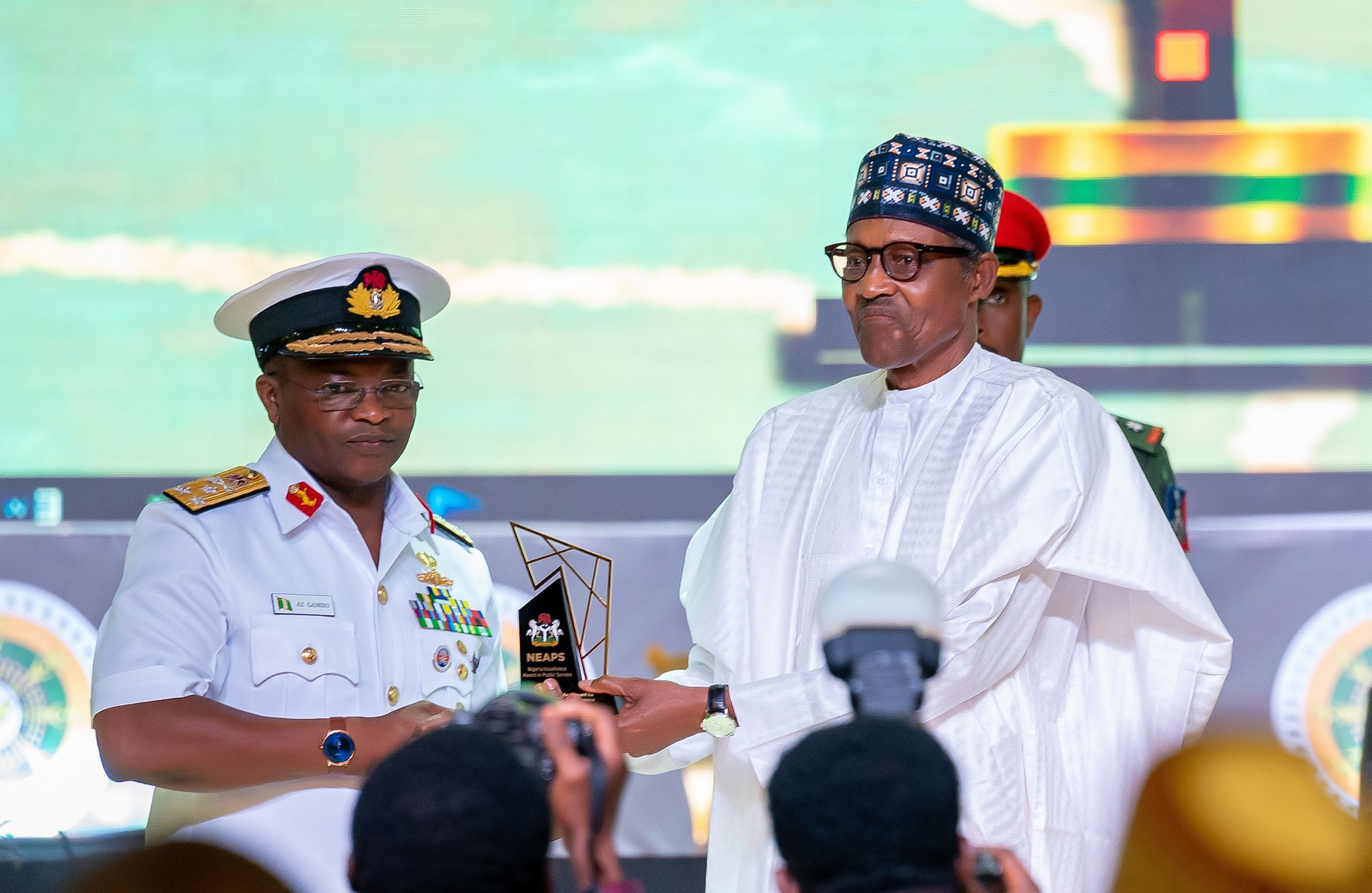 HE Presdient Muhammadu Buhari presenting the award for Military and Paramilitary Service (Special Category) to the immediate past Chief of the Naval Staff, Vice Admiral AZ Gambo