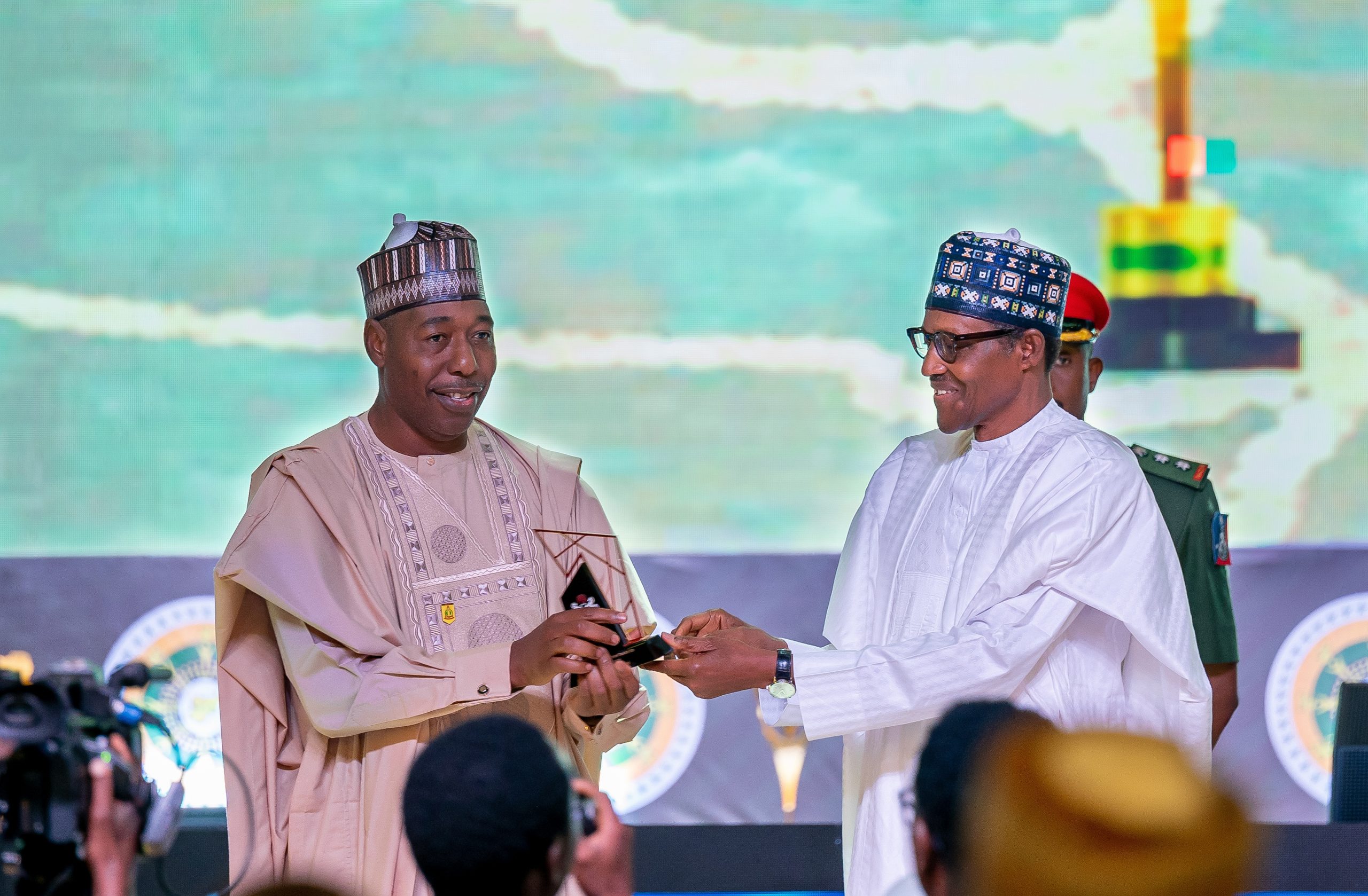 HE Presdient Muhammadu Buhari presenting the award for Post-Insurgency Reconstruction to HE, the Governor of Borno State, Prof. Babagana Zulum