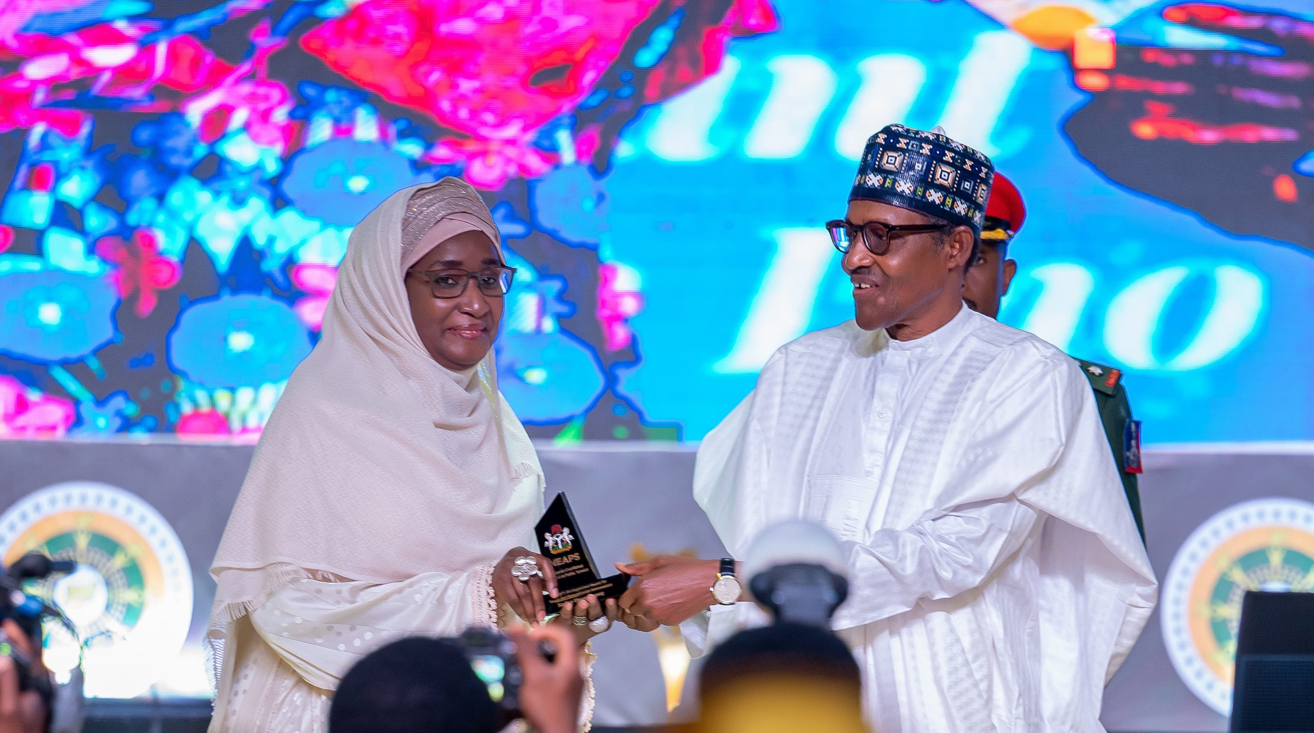 HE Presdient Muhammadu Buhari presenting the award for Social and Humanitarian Interven to the Immediate Past Honourable Minister of Humanitarian, Disaster and Social Development, Sadiya Umar Farouq
