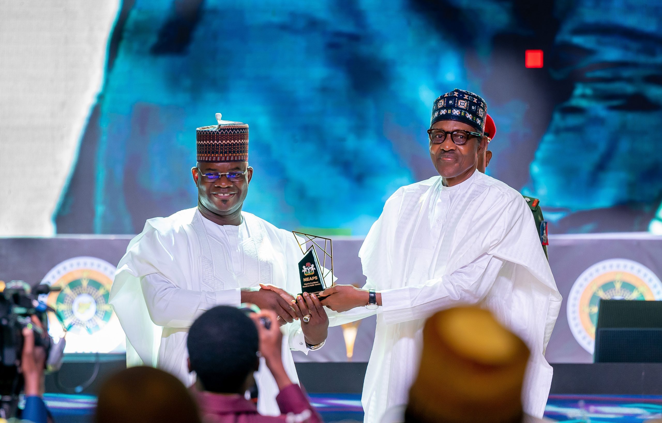 HE President Muhammadu Buhari presenting the award for Security Managment to HE Yahaya Bello the immediate past Gobvernor of Kogi State